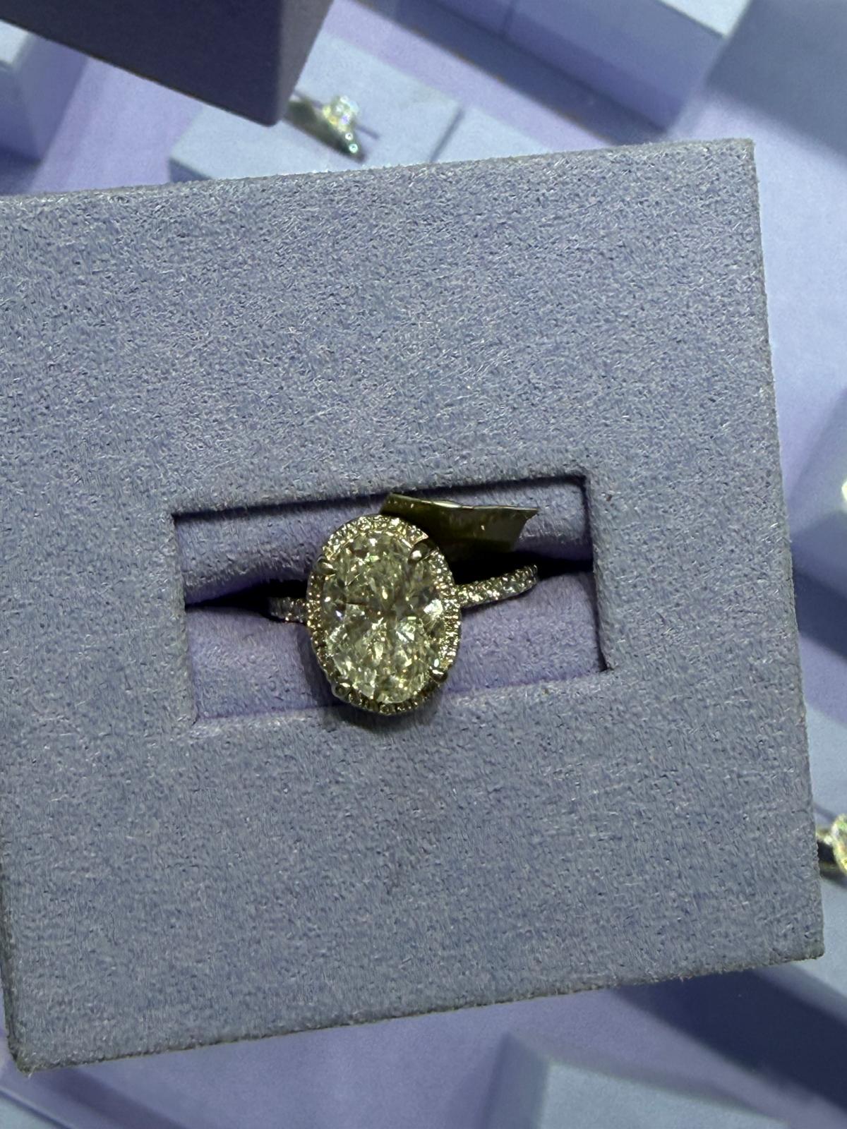 Oval halo ring on a velvet display at BD Jewelrys