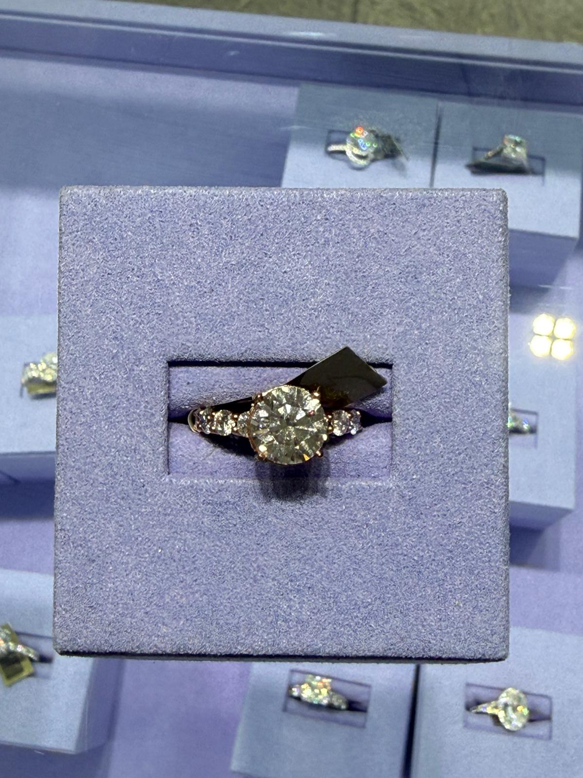 Round center-stone ring on a velvet display at BD Jewelrys
